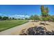 Pathway next to a beautifully landscaped golf course at 13827 W Junipero Dr, Sun City West, AZ 85375