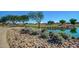 Landscaped walking path alongside a golf course at 13827 W Junipero Dr, Sun City West, AZ 85375