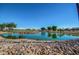 Scenic golf course view with pond and lush greens at 13827 W Junipero Dr, Sun City West, AZ 85375