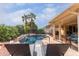 Relax by the pool with lounge chairs and patio furniture at 13827 W Junipero Dr, Sun City West, AZ 85375