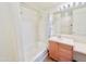 Clean bathroom with tub and shower, vanity with drawers at 1421 N 80Th Ln, Phoenix, AZ 85043