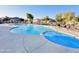 Relaxing community pool and spa with surrounding lounge chairs at 1421 N 80Th Ln, Phoenix, AZ 85043