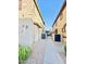 Townhome community with walkway and building exterior at 1421 N 80Th Ln, Phoenix, AZ 85043