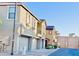 Townhome building with garage parking and street view at 1421 N 80Th Ln, Phoenix, AZ 85043