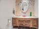 Powder room with a unique glass sink and wood vanity at 14216 S Canyon Dr, Phoenix, AZ 85048