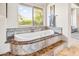 Bathroom with freestanding tub and mountain views at 14216 S Canyon Dr, Phoenix, AZ 85048