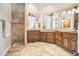 Bathroom with double sinks, shower, and elegant tile at 14216 S Canyon Dr, Phoenix, AZ 85048