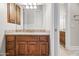 Bathroom with granite countertop and wood cabinets at 14216 S Canyon Dr, Phoenix, AZ 85048