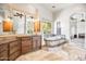 Spa-like bathroom with soaking tub and double vanity at 14216 S Canyon Dr, Phoenix, AZ 85048