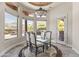 Bright breakfast nook with glass table and mountain views at 14216 S Canyon Dr, Phoenix, AZ 85048