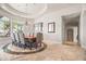 Formal dining room with a large table and beautiful chandelier at 14216 S Canyon Dr, Phoenix, AZ 85048