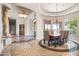 Spacious dining room features a large table and chandelier at 14216 S Canyon Dr, Phoenix, AZ 85048