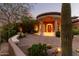 Elegant entryway with a grand wooden door, columns and a travertine floor at 14216 S Canyon Dr, Phoenix, AZ 85048