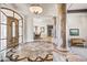 Elegant entryway with marble floors and large wood door at 14216 S Canyon Dr, Phoenix, AZ 85048