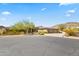 Beautiful home with a three-car garage and desert landscaping in front at 14216 S Canyon Dr, Phoenix, AZ 85048