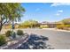 Stunning home nestled on a hillside with a circular driveway and desert landscaping at 14216 S Canyon Dr, Phoenix, AZ 85048