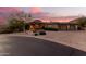 Stunning desert home with a circular driveway and desert landscaping at 14216 S Canyon Dr, Phoenix, AZ 85048