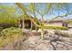 Mediterranean style home with a covered entryway and manicured landscaping at 14216 S Canyon Dr, Phoenix, AZ 85048