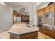 Large kitchen island with granite countertops and wooden cabinets at 14216 S Canyon Dr, Phoenix, AZ 85048