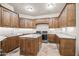 Bright laundry room with ample cabinetry and an island at 14216 S Canyon Dr, Phoenix, AZ 85048