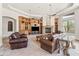 Spacious living room featuring a fireplace and built-in shelving at 14216 S Canyon Dr, Phoenix, AZ 85048