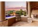 Luxury outdoor kitchen with sunset views at 14216 S Canyon Dr, Phoenix, AZ 85048