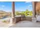 High-end outdoor kitchen with pool and mountain views at 14216 S Canyon Dr, Phoenix, AZ 85048