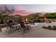 Relaxing poolside view with lounge chairs and fireplace at 14216 S Canyon Dr, Phoenix, AZ 85048