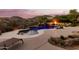 Tranquil pool and patio with lounge chair and sunset views at 14216 S Canyon Dr, Phoenix, AZ 85048