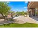 Luxury pool with a waterfall and fire pit features at 14216 S Canyon Dr, Phoenix, AZ 85048