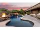 Stunning pool with fire pit and waterfall, mountain views at 14216 S Canyon Dr, Phoenix, AZ 85048