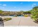 Luxury pool with a waterfall and fire pit features at 14216 S Canyon Dr, Phoenix, AZ 85048