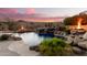 Inviting pool area with waterfall and fire pit feature at 14216 S Canyon Dr, Phoenix, AZ 85048