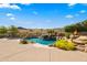 Luxury pool with a waterfall and fire pit features at 14216 S Canyon Dr, Phoenix, AZ 85048