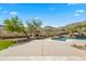 Luxury pool with a waterfall and fire pit features at 14216 S Canyon Dr, Phoenix, AZ 85048