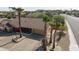 Single-story house with a large yard and palm trees at 14731 W Trading Post Dr, Sun City West, AZ 85375