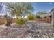 Backyard with a dry creek bed, gravel, and native plants at 14731 W Trading Post Dr, Sun City West, AZ 85375