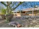 Backyard patio with pergola, gravel landscaping, and desert plants at 14731 W Trading Post Dr, Sun City West, AZ 85375