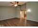 Spacious bedroom with wood flooring and ceiling fan at 14731 W Trading Post Dr, Sun City West, AZ 85375