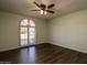 Bright bedroom with dark hardwood floors and French doors at 14731 W Trading Post Dr, Sun City West, AZ 85375