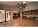 Open dining area with wood cabinets and tile floor at 14731 W Trading Post Dr, Sun City West, AZ 85375