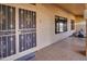 Front entry with security door and tile flooring at 14731 W Trading Post Dr, Sun City West, AZ 85375