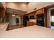 Spacious kitchen with ample wood cabinets, black appliances, and tile flooring at 14731 W Trading Post Dr, Sun City West, AZ 85375