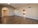 Living room with dark wood flooring and vaulted ceilings at 14731 W Trading Post Dr, Sun City West, AZ 85375