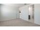 Spacious bedroom with bathroom and hallway access at 15382 W Hackamore Dr, Surprise, AZ 85387