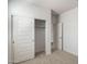 Bedroom with sliding door closet and hallway access at 15382 W Hackamore Dr, Surprise, AZ 85387