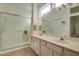 Bathroom with double sinks, shower, and ample counter space at 16148 W Sentinel Dr, Sun City West, AZ 85375