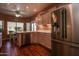 Spacious kitchen featuring stainless steel appliances and wood flooring at 16148 W Sentinel Dr, Sun City West, AZ 85375