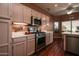 Kitchen with stainless steel appliances and light cabinets at 16148 W Sentinel Dr, Sun City West, AZ 85375