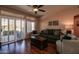 Living room with hardwood floors and sliding glass doors at 16148 W Sentinel Dr, Sun City West, AZ 85375